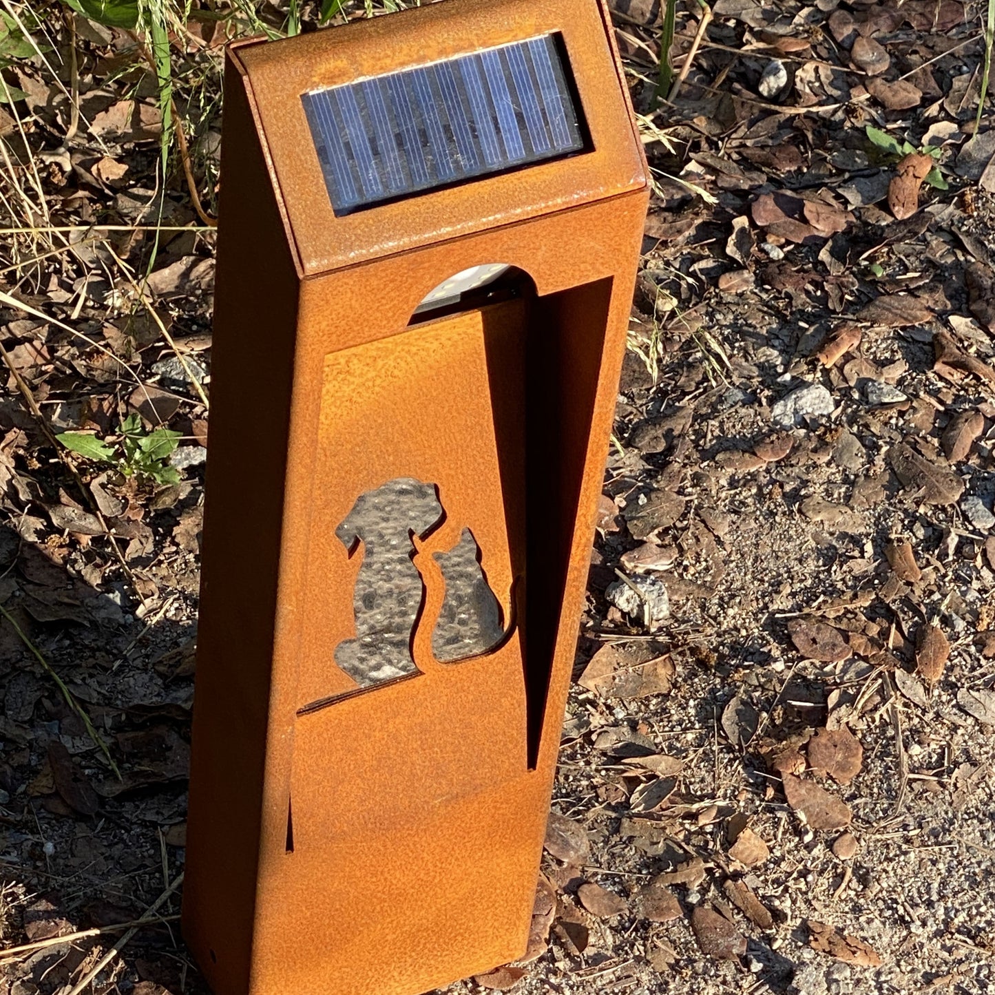 Natural rust Corten solar garden light. Outdoor bollard or beacon with motion sensor. Wireless. Warm white light.
