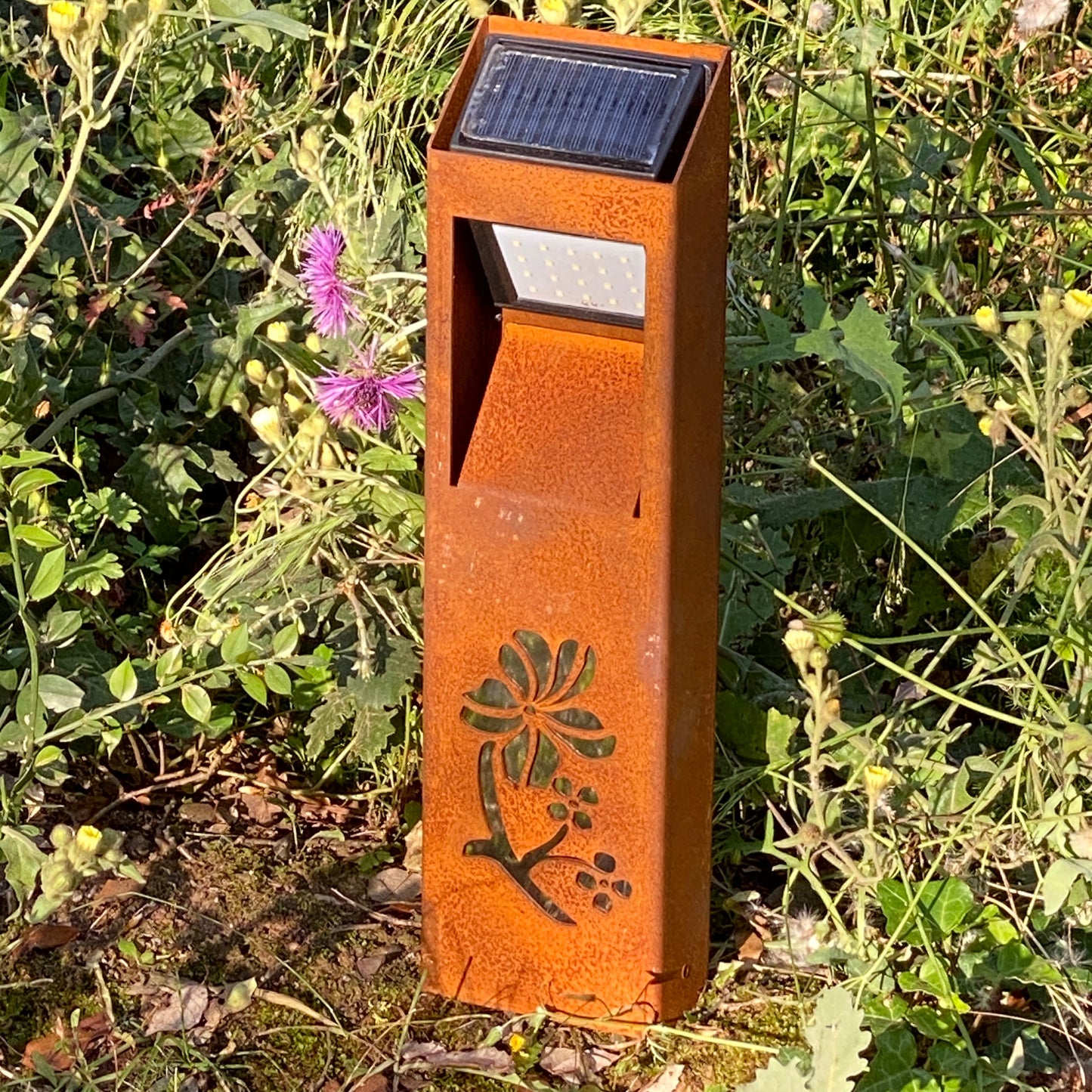 Natural rust Corten solar garden light. Outdoor bollard or beacon with motion sensor. Wireless. Warm white light.