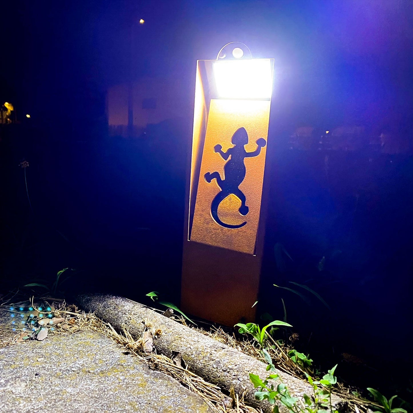 Natural rust Corten solar garden light. Outdoor bollard or beacon with motion sensor. Wireless. Warm white light.