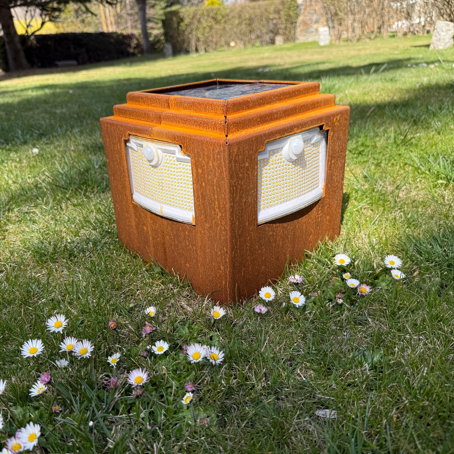 Natural rust Corten solar garden light. Powerful outdoor bollard or beacon with motion sensor. Wireless. Warm white light.