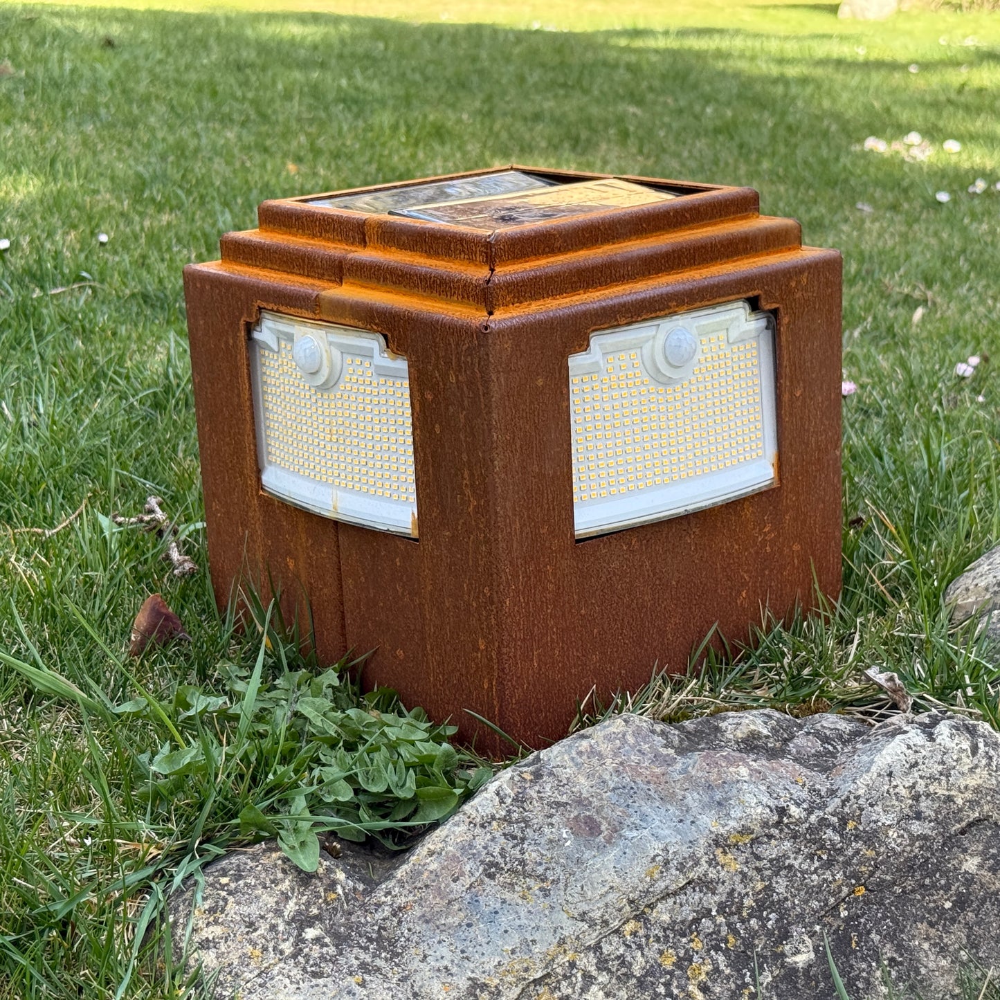 Natural rust Corten solar garden light. Powerful outdoor bollard or beacon with motion sensor. Wireless. Warm white light.