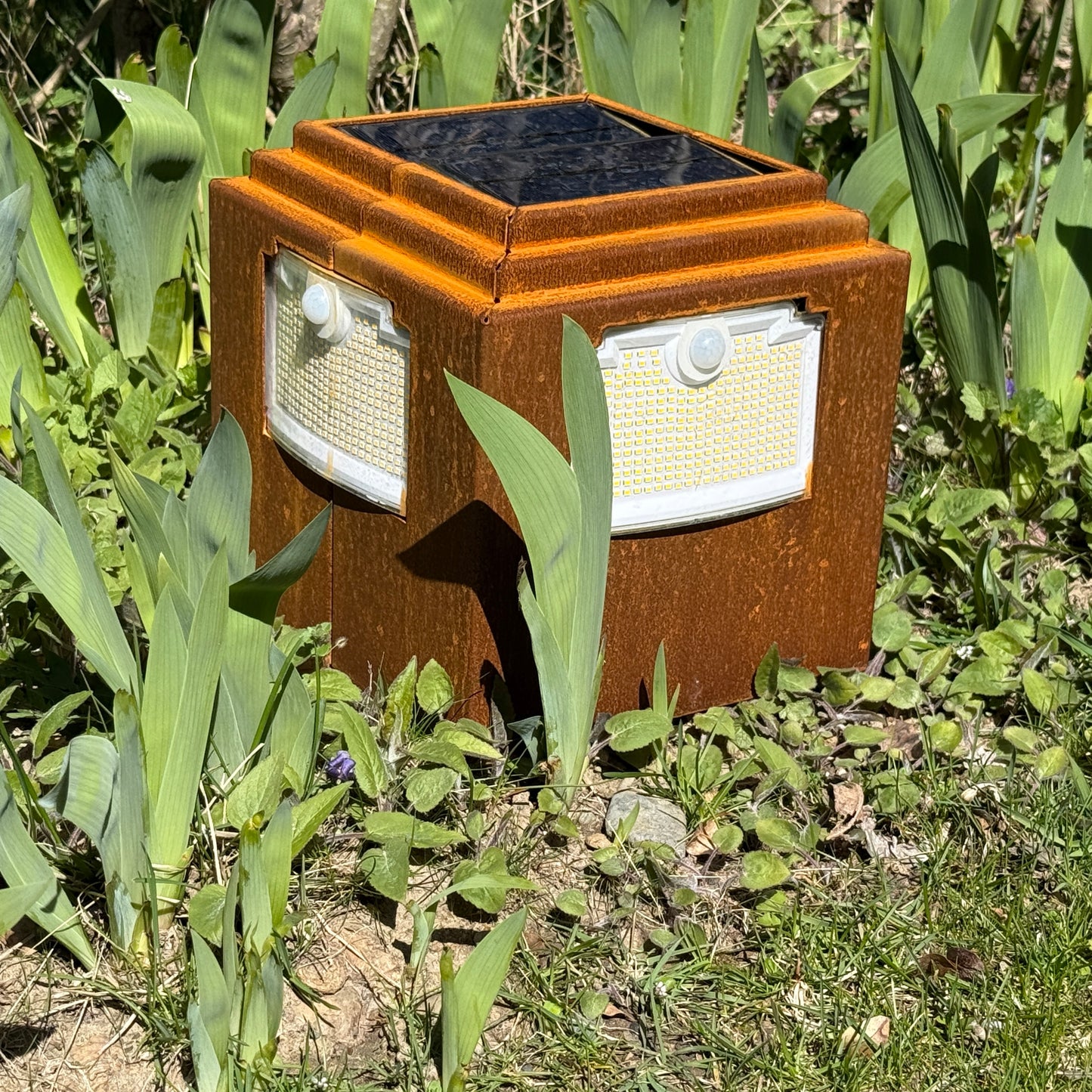 Natural rust Corten solar garden light. Powerful outdoor bollard or beacon with motion sensor. Wireless. Warm white light.