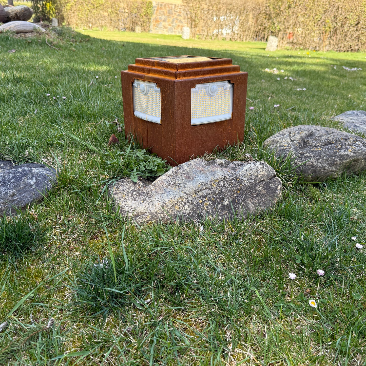 Natural rust Corten solar garden light. Powerful outdoor bollard or beacon with motion sensor. Wireless. Warm white light.